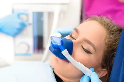 woman sleeping during her dental appointment thanks to sedation dentistry at Ankeny Dental Professionals