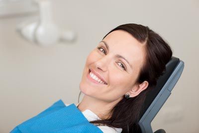 woman smiling during her restorative dentistry appointment at Ankeny Dental Professionals